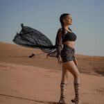 Garima Chaurasia Instagram - Wanderlust and desert dust.. 🌪️ . . . 📸: @nitin_.1610 Edit: @welcomeishu3694 #gimaashi #desert #Dubai #photoshoot #sanddunes #safari #desertsafari #gimaians #blackislove Desert Safari Dubai