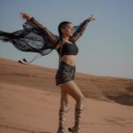 Garima Chaurasia Instagram - Wanderlust and desert dust.. 🌪️ . . . 📸: @nitin_.1610 Edit: @welcomeishu3694 #gimaashi #desert #Dubai #photoshoot #sanddunes #safari #desertsafari #gimaians #blackislove Desert Safari Dubai