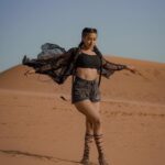Garima Chaurasia Instagram - Wanderlust and desert dust.. 🌪️ . . . 📸: @nitin_.1610 Edit: @welcomeishu3694 #gimaashi #desert #Dubai #photoshoot #sanddunes #safari #desertsafari #gimaians #blackislove Desert Safari Dubai