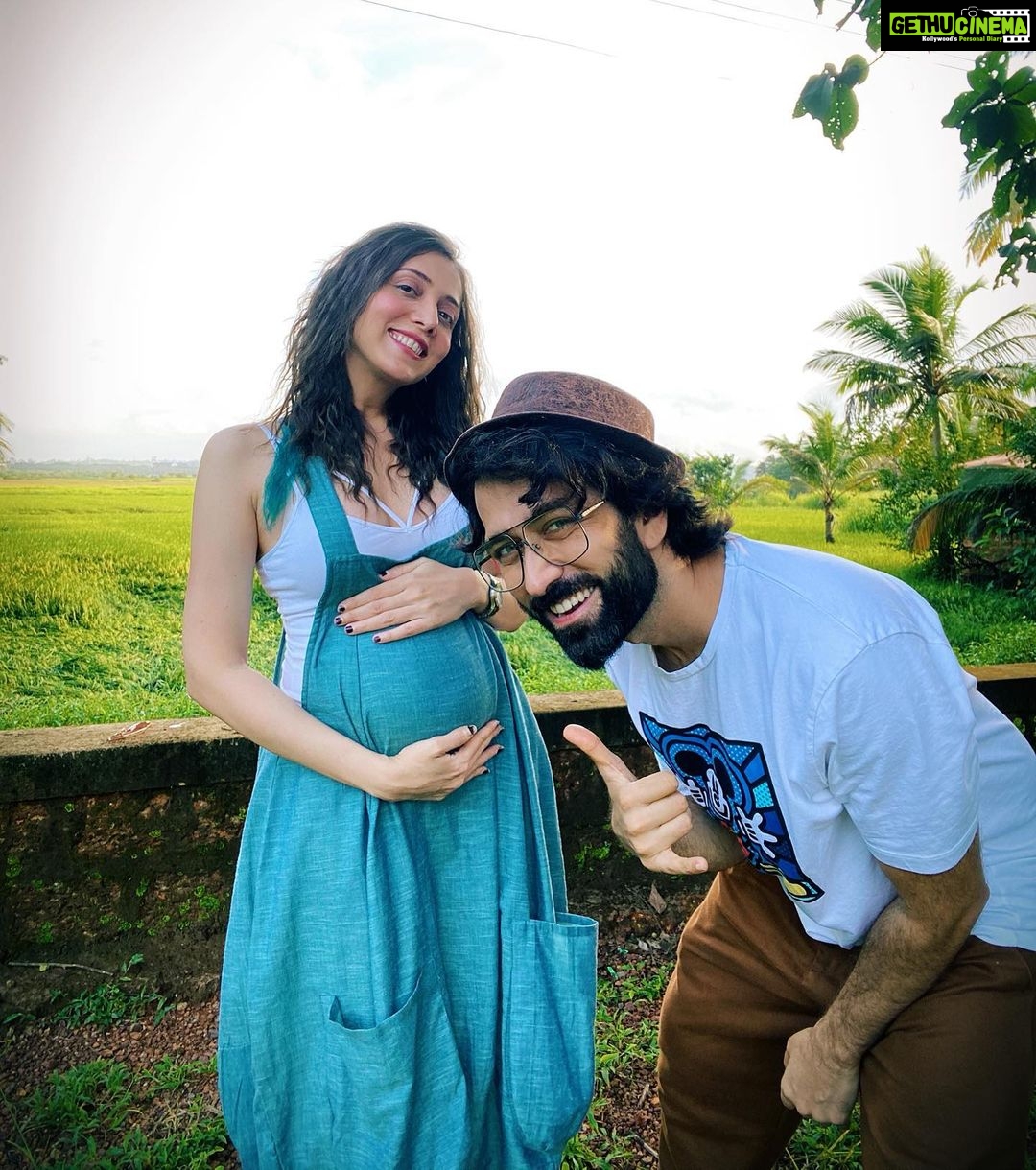 Jankee Parekh Instagram - Through our month long stay in Goa last year (Sept. 2020) I remember only taking photographs chest up as I was 5 months pregnant and we had still not announced it. I remember getting so annoyed with Nakuul because I would never be able to share any of the pictures I had taken simply because of my bump showing. Then one day, whilst we were day-tripping in Dewar island, I told Nakuul, 'Enough is enough, it’s time we just put it out that we are expecting'. And to my surprise, he was like 'Cool, let’s do it.' He stopped the car in the middle of nowhere, got the tripod out of the car, took me right in the middle of these gorgeous fields, put the camera on timer and asked me to pose... And I was like 'Wait, what am I suppose to do?' He asked me to just hold my belly. And just like that we got the photo to announce our pregnancy. It’s only when we got back to our villa, I realised that my chipped nail paint looked horrible in the photograph and I canned the idea of announcing my pregnancy that day. All of next day Nakuul and I went looking for a nail paint remover from one pharmacy to the other, until we finally found one. So that's the story behind why we didn't go with the "Holding Belly in the Green Fields with the messed up Nails" photo... Sounds a little lame right now, but my pregnancy hormones dint make me feel that way... Now that I have a child, it’s made me realise that chipped nail paint is the most non existential crisis one can even imagine amidst a plethora of real ones... Did any of you ever go through such frivolous drama while being preggers and your partner played along? #motherhood #firsttimemom #pregnancydays #goadiaries #babymoon