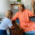 Jankee Parekh Instagram - Friday was a special day. I met my guruji after almost 2 years. Thank you, pandemic. But what was even more special was that he held my little Sufi for the very first time. Guruji has been telling me for years ‘Mujhe Nana banaado, Mujhe Nana banaado '. And finally ' Maine unhe Nana bana hee diya 😃😃'! When Sufi laid his eyes on Guruji, he almost instantly latched on to him. He sat so comfortable in his lap, and very attentively listened to every word that he said. Sufi also had his first singing lesson with him where Guruji taught him ‘Sa’ and Sufi in turn showed Guruji all the sounds he can make with his vocal chords :) Sufi’s curious eyes couldn’t get enough of the harmonium. He kept pressing the keys all day and was so happy that Mumma finally got him his first real musical instrument. What can be more special than Sufi getting blessings from my Guru who I have spent half my life with. Guruji now looks forward to coming home more often, not just for me, but also for his grandson, to introduce him to the world of music and share life lessons with him just the way he has has been sharing with his daughter for all these years. #sufiandMaa #singingmama