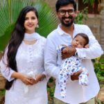 Nanditha Jennifer Instagram - Ghayaan's 100th day.. first outing With mom & dad.🤍🤱🏻🤍🧿 . . . #blessed #holyplace #mom #dad #love #cute #smile #thankful #ghayaan23 #jenniferr252 #kasicinematographer6 #instagram #instagood #actress #celebrity #white