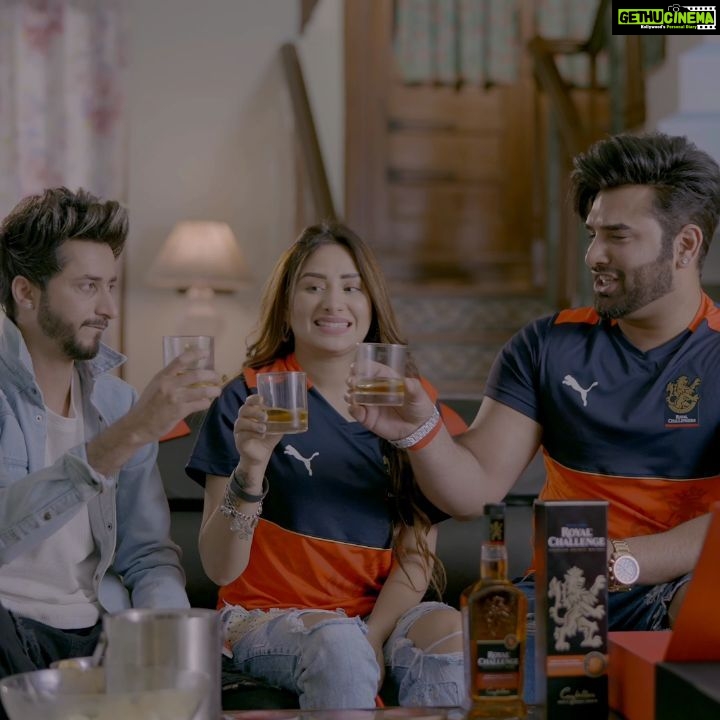 Paras Chhabra Instagram - All set for the game night on my lucky seat with our favourite #RoyalChallenge Game Nights kit, and toasting the match with my best friends and the All-New #RoyalChallengeWhisky! Here’s to a smoother and richer match-viewing experience and bringing a stadium-like vibe to our home. Our Game Nights experience has never been better! We are all set to cheer for RCB now and toast to the Spirit of Challengers this T-20 season. Are you? Comment with your favourite Game Night moments using #RCGameNights and one of you can win the ultimate match-viewing experience with the Royal Challenge Game Night kit! #Spon #RCGameNights #RoyalChallengeWhisky #SpiritOfChallengers #DrinkResponsibly @socialgoatindia *All-New RC is currently available in select markets only. @akkezzz @officialmahirasharma