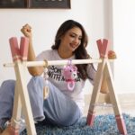 Pooja Banerjee Instagram - Hey husband @sandeepsejwal , @sanassejwaal is gonna have a lot of fun and is also going to be inspired looking at all your achievements while playing in her play gym area . Swipe to the end & watch me tie the beautiful crochet crib you from @the_original_knit #DadLife #MomLife #NewDad #NewMom #BabyLove #BabyGirl #SanaSSejwaal #SandeepSejwal #PoojaBanerjee 📸- @jerry__creations Thank you @thedotdiary for setting all this up for me ❤️🧿