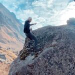 Raghav Juyal Instagram – @0the_lost_traveller @kharola_yash and me on top of this rock