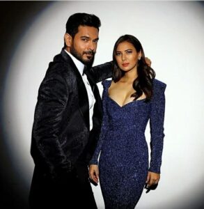 Rochelle Rao Instagram - “At 25, while I was living my showbiz dream in Mumbai, my personal life plummeted. Tired of pointless relationships, I’d almost given up on love, when Keith joined my church group. Coming from the same industry, it didn’t take long for us to become friends; we’d hang out every weekend–I’d think of girls I could set him up with! But soon, I realized that Keith was what I was looking for–sweet, intelligent & serious about love. I fell for him, but he was oblivious–until his birthday, when I went all out with gifts, & he finally got the hint. Days later, while walking me home, he kissed me. That’s how we began dating!
The first 2 months of our relationship were hush-hush, until the press spotted us together. Soon after, we got offered Bigg Boss. I told him, ‘I don’t mind, as long as I have you.’ Many thought our relationship was a publicity stunt, but we couldn’t care less!
We entered the Bigg Boss house, & it was going well–Keith would even make me coffee everyday. But a few weeks in, he was pulled out overnight; no one told me why. When he finally came back, a month later, I was overjoyed! But finding out his brother had passed away broke my heart! I asked, ‘Why come back?’ & he said, ‘I’d rather mourn with you.’ I thought, ‘If we get through this, we can get through anything.’ By the end of that show, I knew he was the one.
But 1 year later, Keith still hadn’t proposed! Once, on my birthday, he was giving me a gift & all my friends took out their cameras–convinced he was going to do it. But he gifted me boots! How anticlimactic!
Months later, Keith hinted at a ‘special’ trip. By then, I was done. I burst out, ‘If you’re going to propose, just do it!’ I ranted so much that in the heat of the moment, he said, ‘Fine, if this is the way you want it!’ Then, he got down on one knee, pulled out a ring & asked, ‘Will you marry me?’ It was crazy, but it was SO us! We celebrated with champagne.
In 2018, we tied the knot. Our vows were beautiful, & after, we ate dosas & danced with our loved ones. It’s been 4 years since, & we still keep each other on our toes. But he keeps me centered, too! Everyday, I wake up, knowing I’ve Keith’s coffee & smile to look forward to!”