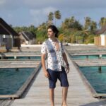 Rohan Mehra Instagram - Villa over the water ✅ Beach outfit ✅ Shades of blue & green palm trees ✅ Perfect island vacay 🌴 . . . @fushifaru @wanderxo_ #fushifaru #fushifarumaldives #feelingfantastic #chicboutique #Funinthesun #maldives Fushifaru Maldives