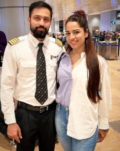 Shikha Singh Instagram - The airport look with Mr. professional @car_run in uniform & half shirt out me chilling by his side!! 

#pilot #actor #travel #tourism #travelphotography #travel #meninunifrom #white #flight #flying #mine #us #couplegoals #boyfriend #husband #lover #love #blessed #blessedwiththebest #thankyou #excited #live #loveforever