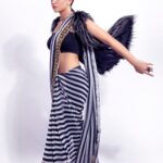 Shruti Sharma Instagram - She stood tall. With the glory of scars and her demons kneeling at her feet🧚 Outfit:- @boutiquelibrary Styling:- @sonammbissakunjir Mua:- @shikhashah_mua Photographer:- @faizankhan.6 Bags:- @umabagsofficial #stripes #sareedraping #indianwear #fashiongram #faishon #shrutisharma #styleinspiration