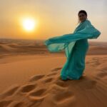Yamini Malhotra Instagram - Bollywood Style in Dubai - Habibi come to Dubai and plan your desert safari with @desertrovers.tourism - make ur own Bollywood themed videos . It was a wonderful experience with @desertrovers.tourism - bookings were convenient , I got a private pick up from the hotel , driver was very friendly and guided us properly, next the sand dune bashing was crazy and full of thrill, at sunset we were taken to a point where we could shoot some amazing reels in the desert and finale was at the camp with dinner , belly dance and other Arabic dances . Save the post and next time when you have to plan the trip to Dubai , book it with @desertrovers.tourism Special thanks to Mr Taha and Mr Ahmad for making my safari so wonderful 😇 Saree by @aanandsarees . #desertsafari #desertphotography #surajhuamaddham #surajhuamadham #bollywoodsongs #bollywoodstyle #kajol #shahrukhkhan #desertsafaridubai #dubai #dubaitravel #dubaitrip #dubaitourism #dubaibloggers #dubaivlogger #dubaitourpackages #dubaigirls #dubaidesert #dubaiblogger #dubaiblog #habibi #habibicometodubai Desert Safari Dubai