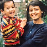 Akhil Akkineni Instagram - Will end a good Sunday with a blast from the past! A picture of mini me with my sunshine ! 😘 #motherdear