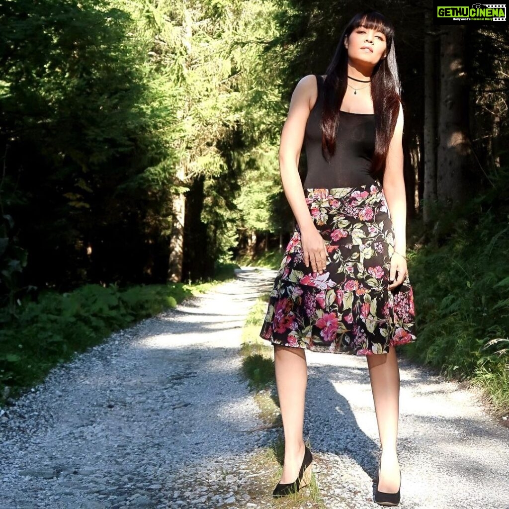 Celina Jaitly Instagram - #FromTheDeskOfCelinaJaitly MY ALPINE LIFE | #AUSTRIA Captured for posterity in this photograph are the last rays of summer sunshine in 9 degrees centigrade, a magical forest and a girl who believes that she is a forest fairy !! Even as a child I could graft two colours of Roses to create a new variety thanks to my grandfathers teachings and till today I can proudly resuscitate most dying plants. My Nana( maternal grandfather) and I would take long walks in the botanical gardens of Lucknow where he would have endless talks with some of his botanist friends and experienced Maali’s. I would learn so much about all varieties of flowers and fruits. My Nana was a military man but forestry & gardening was his passionate hobby. He took me as a little girl to meet many eminent botanical scientists and their talks over tea and samosas must have somehow lead me to discover my magical green fingers. As a fauji/Army kid my upbringing in Kashmir, Arunachal, Ranikhet ,Assam, Nagaland, Bhutan etc was impacted strongly by the local treasure trove of rugged mountains and their stunning forests & flora which taught me, if one tunes into the magic within the trees they will teach you what is resilience and their energy will open the doorway to find the Universe. My other home country “Austria” where I live now is divinely beautiful as well so as always I would like to share a photo of the places special to me, places where you loose your mind to find your soul. Photograph | @haag.peter #forest #ilovenature #alpinebabes #alpinelife #austrian #austriangirl #celina #celinajaitley #celinajaitly #bollywood #fairy #forestfairy #explorerpage #missindia #missuniverse #forestsofinstagram Austria, Europe