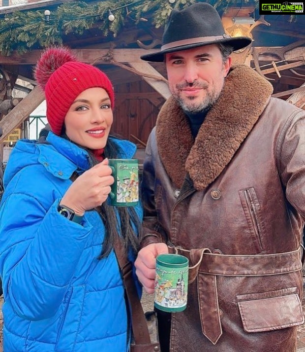 Celina Jaitly Instagram - When Miss India and Indiana Jones meet for Tea does it qualify as an archeological survey ??? 😉 Me and my miyaa @haag.peter at the winter festival of Mariazell the famous church of miracles in #austria #peterpyaari #celinajaitly #Bollywood #missindia #MissUniverse #indianajones #europe #mariazell #churches #celinajaitley #peterhaag #winterwonderland #winterfashion #wintertime #internationalfamily #europeanhusband #husbandsofinstagram #🪬 #🧿 #visitaustria #österreich #meineliebe❤️ #austrianalps Basilika von Mariazell