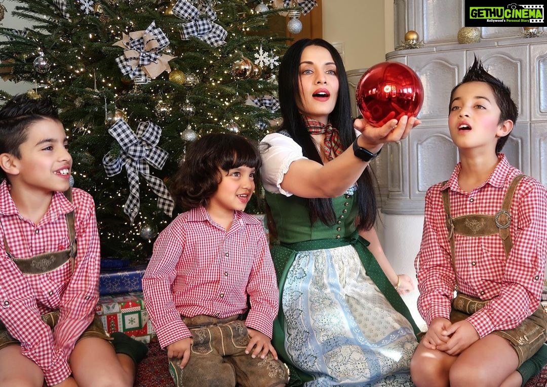 Celina Jaitly Instagram - Great stories happen to those who can tell them to the engineers of future !!! Sharing a bit of my magical and traditional Austrian Christmas with you all from with @winstonjhaag @viraajjhaag @arthurjhaag Frohe Weihnachten!!! Photograph | @haag.peter #christmas #austria #alpinelife #dirndl #lederhosen #weinachten #twinsplusone #internationalfamily #bollywood #indianactress #celina #celinajaitly #celinajaitly #winstonjhaag #viraajjhaag #arthurjhaag #haagbrothers #europeanchristmas Austria, Europe
