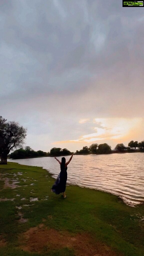 Krystle D'Souza Instagram - Unexpected drizzle by the lake at sunset was the icing on the cake 🥂 . . . #everydarkcloudhasasilverlining This Lake is a half an hour drive from @narendra.bhawan.bikaner where they organised such a beautiful sunset setup ✨ #Lake #Travel #incredibleindia #lakeside #sunset #champagne #dancingintherain #rain #bikaner #narendrabhawan #palace #holi #trip #greyskies Narender Bhavan, Bikaner