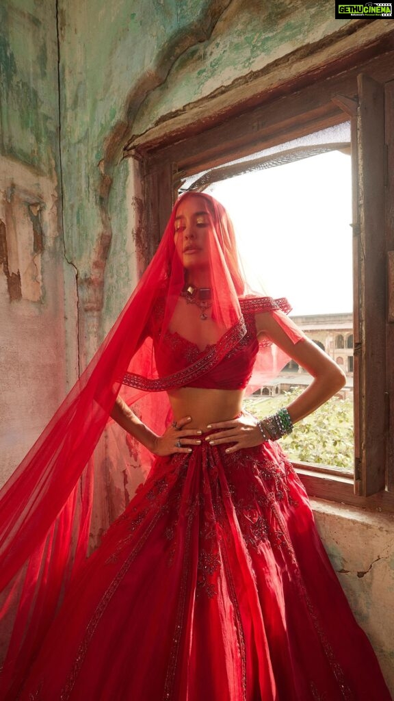 Lisa Haydon Instagram - We celebrate this glorious milestone in the journey of Ridhi Mehra with our forever love and muse, Lisa Haydon Lalvani (@lisahaydon). Adorning her indomitable charm and allure is 𝒁𝒆𝒆𝒂𝒏𝒂 - an enchanting lehenga drenched in regal red paired with a draped blouse and a hand-embroidered dupatta. 𝐍𝐎𝐎𝐑𝐄𝐙𝐀 | 10th Anniversary Collection Now Live! Shop the collection ⭐ Online at RidhiMehra.com ⭐ At our flagship store: The Kila At Seven Style Mile, Mehrauli, Delhi⁠ Call/WhatsApp: +91 9818870573 ⭐ At our DLF Emporio store: Call/WhatsApp: +91 9818370088 ⭐ At our Chhattarpur studio Call/WhatsApp: +91 9818072244 Music: @gurbanibhatia Styling & Creative Direction: @gopalikavirmani Photography: @madetart Videography: @studiothirty6_films Hair & Makeup: @fashionmakeupbyitikachugh Production: @sanju_glaze_production #RidhiMehra #10YearsOfRidhiMehra #ADecadeOfRM #LisaHaydon