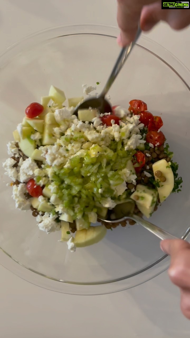 Lisa Haydon Instagram - Ok peeps, has been a minute. This lentil salad was made the same day/ part of the same meal as the corn salad… we had it with grilled fish (I’ll post that video tomorrow. Haven’t had the chance to edit these vids, so they are coming in late. My husb was craving La Petite Manson food this night. But, we were detoxing, and didn’t want to actually go to the restaurant and get tempted with dessert and wine etc.. so again, this is my take on LPM’s lentil salad. Taaa daaa SALAD DRESSING 2 grated/chop small cloves of garlic 1/3 cup extra virgin olive oil 1/2 a lemon 4 tablespoons white vinegar 1 tablespoon honey Salt + pepper to taste Mix SALAD 1 stalk chopped celery - soak this in the dressing while you boil.. 1.5 cooked cups of brown/puy lentils (this is the measurement once it is finished boiling) 2 big tablespoons of spring onion. Chop small small. 1 green apple 2 handfuls grilled or not grilled sweet and delightful cherry tomatoes ( I won’t grill next time). 1/2 block of feta cheese. Crumbled. Mix. Let the dressing soak into the lentils for about 20 mins. Eat. #LisaInTheKitchen #LisaEats #bringithome