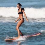 Lisa Haydon Instagram – Have always been scared to surf in Bali.. the waves seem huge and verryyyyy professional. The other day I was surfing a big foam board, so scared after not being in open ocean surfing like this in three years, and sooo rusty. Basically spent the morning in “the laundry” as our teacher Nyoman puts it. Haha, if you know you know 🫣. But as my husband quite rightly says “don’t waste a day in Bali” … in other words, if you don’t get out there, you didn’t live it to the fullest. Second slide has a wee little friend 🐢 that popped his head up a few times this morning 🫶🏽🫶🏽🫶🏽 If you’re ever in Bali head to Batu Balong for some sweet baby waves and ask for Nyoman who will push you onto the wave🙃enjoyyyyy 
#BaliHai #BaliHigh 
@lareveche