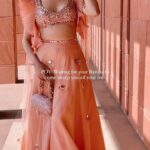 Nitibha Kaul Instagram - Patiently waiting for my own SidKiara happy ending 🥹 Wearing @supriamunjalatelier Bag @eena.official #WeddingOutfit #PeachLehenga #BridesmaidsFit #LehengaInspiration #MirrorWork #NKDesi #Ranjha #SidKiara