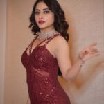 Niyati Fatnani Instagram - Roses or chillies ? You decide 🥀/🌶 Swipe👈 ______________________________________ Styled by: @praanavsrathod Wearing: @aashiluthrastore HMU &Jewellery: @makeoverbysejalthakkar and team Pc: @barkhafatnani 💫 . . . . #reddress #longhair #glamnight #niyatifatnani