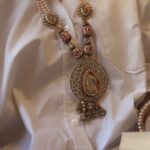 Pankhuri Awasthy Rode Instagram - The SABRAMANI long necklace features a large, intricate pendant that is both bold and beautiful. The pendant is expertly crafted and designed to catch the light, adding a touch of sparkle to any outfit. The ALBELA bangles are equally stunning, with their delicate white beads and intricate design. These bangles are perfect for layering or wearing alone, adding a touch of elegance and sophistication to any outfit. Together, the SABRAMANI necklace and ALBELA bangles create a stunning set that is sure to make a statement. #HouseofAekaya #jewellery #necklace #pendant #bangles #reels #explorepage #oneofakind #pearls #accessories #beads