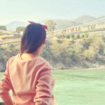 Pooja Sharma Instagram - I would love to live like a river flows , carried by the surprise of its own unfolding. #Rishikesh #lakshmanjhula #nature #bliss #himalayanfoothills