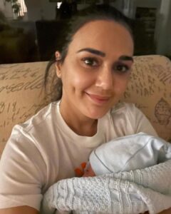 Preity Zinta Instagram - All set to watch the Tata IPL Auction tonight. Feels amazing to have a cute warm baby in my arms instead of the red auction paddle 😂 On a  serious note my heart is racing and I cannot wait for our new PBKS squad.  All the best @punjabkingsipl 👍👍 Let’s execute our plans and stay focused. #Tataiplauction #saddasquad  @iplt20  #ting 🌟 #motherhood