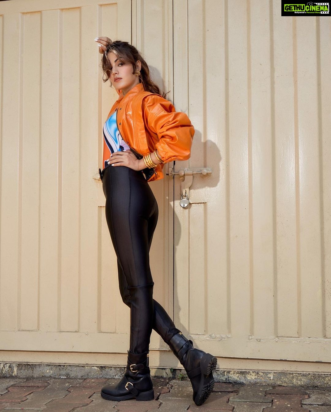 Rhea Chakraborty Instagram - Orange is the new 🖤! #rhenew Styling : @theanisha Bodysuit and Bomber : @cilvrstudio Boots : @vanillamoonshoes Jewellery : @radhikaagrawalstudio Makeup : @makeupbyrishabk Hair : @richie_muah 📸: @kaasastudio