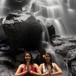 Akshara Gowda Instagram - In the wild, chasing waterfalls with your bestie hits different! This one was at Kanto Lampo waterfall in Bali and unlike other waterfalls this one was safe to stand or sit under. This waterfall is also very easy to get to and you don’t have to go through miles and miles of hiking and trekking to reach here. If you are a photography enthusiast, you can climb up the rocks on the top of the waterfall and get some nice, instagram worthy pictures. . . #bali #wonderfulindonesia #baliwaterfalls #chasingwaterfalls #waterfall #girlstrip #travelwithbestie #travelgram #luxurytraveller #zenmode