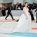 Alia Bhatt Instagram - Met Gala — Karl Lagerfeld: A Line of Beauty I have always been fascinated by the iconic Chanel brides. Season after season, the genius of Karl Lagerfeld shone through in the most innovative and awe-inspiring couture. My look tonight was inspired from this and in particular by supermodel Claudia Schiffer’s 1992 Chanel bridal look. I wanted to do something that felt authentic (hello, pearls!) and proudly made in India. The embroidery, made with a 100,000 pearls is a labour of love by @prabalgurung. I’m so proud to wear you for my first Met. Make up was my go to beautiful glowing sheer skin but this time with wayyyyyyyy more blush to give the look all that romance, rounding it off with a smudgy defined eye with Kajal one the inside (our subtle ode to Karl’s sunglasses 🕶️) A girl can never have too many pearls… and the right accessories to complement the look which in our case translated to the bow of pearls on my hair. Oh, and it’s white, for my Choup-ED🐱