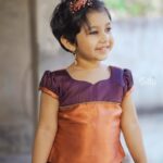 Alya Manasa Instagram – Aila looking super cute in this wonderful Pavadai Sattai from @suttis.kids 
.
Experience elegance at its best for your little girls with this nava purple semi silk pavadai and top! The beautiful knife pleated nava purple skirt with a copper border and elegant designs is paired with a puff sleeved top in purple and copper. The unique border on the top with exquisite zari details gives it a truly serene look!
.
Outfit: @suttis.kids 
Photography @p2click.in 
.
Follow them today and get your little one a special outfit today!!
.
#kids #kidswear #silk #traditional  #cotton #topandskirt #buttas #pavadai #set #traditional #style #elegance #pattupavadai #pattupavadailove #handloom #pattu #chennai #zari #silver #gold #silklove #suttis #suttiskids #cotton Loves her smile 😃 cutie pie #aila @suttis.kids outfit