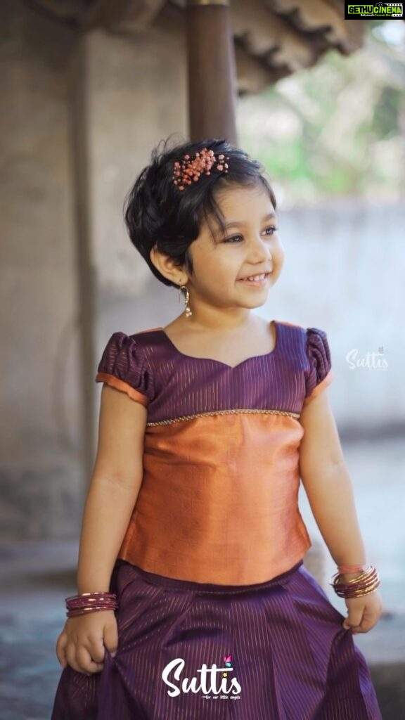 Alya Manasa Instagram - Aila looking super cute in this wonderful Pavadai Sattai from @suttis.kids . Experience elegance at its best for your little girls with this nava purple semi silk pavadai and top! The beautiful knife pleated nava purple skirt with a copper border and elegant designs is paired with a puff sleeved top in purple and copper. The unique border on the top with exquisite zari details gives it a truly serene look! . Outfit: @suttis.kids Photography @p2click.in . Follow them today and get your little one a special outfit today!! . #kids #kidswear #silk #traditional #cotton #topandskirt #buttas #pavadai #set #traditional #style #elegance #pattupavadai #pattupavadailove #handloom #pattu #chennai #zari #silver #gold #silklove #suttis #suttiskids #cotton Loves her smile 😃 cutie pie #aila @suttis.kids outfit