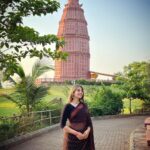 Anagha Bhosale Instagram – Significance of the Madan Mohan temple-
Sri Madana Mohana Ji is presently worshiped at Karauli, Rajasthan….. When the daughter of the king of Jaipur was offered in marriage to the king of Karauli, she very insistently requested that her father send Lord Madana Mohana with her as a dowry, as she was very attached to Him…… Her father was very reluctant and agreed only after stipulating one condition: ” Shri Madan Mohan would be placed in room with many other Deities….. Whoever she chose whil blindfolded could go with her to Karauli.”
Shri Madan Mohan Ji reassured her by telling her that she would be able to recognize Him by the soft touch of His arm….. By this way, she easily recognized Madan Mohan who still resides in Kaurali till this day….. 

Madan Mohanji also told her in dream that I will break my flute so you find the Thakurji with the broken flute. So you see the deity only half the flute as he moved his hands and you can’t put it all the way through! Or sometimes they put half in one side and half in the other. Before I knew this I thought it was just an optical illusion that you cannot follow the flute straight with your eyes! Govardhan Ecovillage