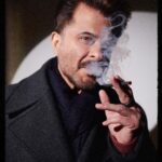 Anil Kapoor Instagram - "Dhuan utha hai, kahin aag jal rahi hogi" Shelly woh aag bhi hai aur dhuan bhi... #TheNightManager @disneyplushotstar Photographer: @vaishnavpraveen @thehouseofpixels Stylist: @kshitijkankaria And @saloniparekh__ Makeup Artist: @deepakchauhanartist Hairstylist: @raskarjaipal @whynot_byzeeba Disclaimer : Smoking is injurious to health. India