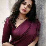Ann Augustine Instagram - This is a season for Red, May this be a time to reflect on small joys and tiny moments of happiness that showed us who we truly are, and gave us strength and hope to keep going no matter what. Merry Christmas to all of you!❤️ 📸 @clintsoman #red#christmasfeels#christmasvibes#saree#sareelove#life#art#jewelleryaddict#curls#curlyhair#coffeelover#magichour#tattooart#silver#silverlove#soulful