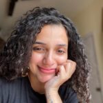 Ann Augustine Instagram - That Feeling good bout myself ‘PSYCHO-tee’ smile! #psycho#favourite#psychotee#curls#curlyhair#jewelleryaddict#goodhairday#silverlove#coffeelover#staysafe#beachlover#home#favtees#feelinggood#artlover