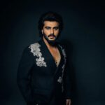 Arjun Kapoor Instagram - Spent last evening in my very own custom made double breasted black suit by the very special @anamikakhanna.in ♥️ Loved the exhibit at #NMACC, it truly represented our culture & the evolution of the landscape of fashion inspired by india 🇮🇳 kudos to the Ambani family & @rooshadshroff for giving us something so unique! 🙌 @nmacc.india Photographer: @bharat_rawail Stylist: @rahulvijay1988 Assisted by: @maitriidesaii @sabrinawhite98 @nirikshapoojary_ Jewellery: @amrapalijewels Hair: @aalimhakim @bashirsayyed.hair Make-up: @vickybanatkar