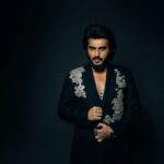 Arjun Kapoor Instagram - Spent last evening in my very own custom made double breasted black suit by the very special @anamikakhanna.in ♥️ Loved the exhibit at #NMACC, it truly represented our culture & the evolution of the landscape of fashion inspired by india 🇮🇳 kudos to the Ambani family & @rooshadshroff for giving us something so unique! 🙌 @nmacc.india Photographer: @bharat_rawail Stylist: @rahulvijay1988 Assisted by: @maitriidesaii @sabrinawhite98 @nirikshapoojary_ Jewellery: @amrapalijewels Hair: @aalimhakim @bashirsayyed.hair Make-up: @vickybanatkar