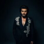 Arjun Kapoor Instagram – Spent last evening in my very own custom made double breasted black suit by the very special @anamikakhanna.in ♥️

Loved the exhibit at #NMACC, it truly represented our culture & the evolution of the landscape of fashion inspired by india 🇮🇳 kudos to the Ambani family & @rooshadshroff for giving us something so unique! 🙌
@nmacc.india

Photographer: @bharat_rawail
Stylist: @rahulvijay1988 

Assisted by: @maitriidesaii @sabrinawhite98 @nirikshapoojary_
Jewellery: @amrapalijewels 

Hair: @aalimhakim
@bashirsayyed.hair
Make-up: @vickybanatkar
