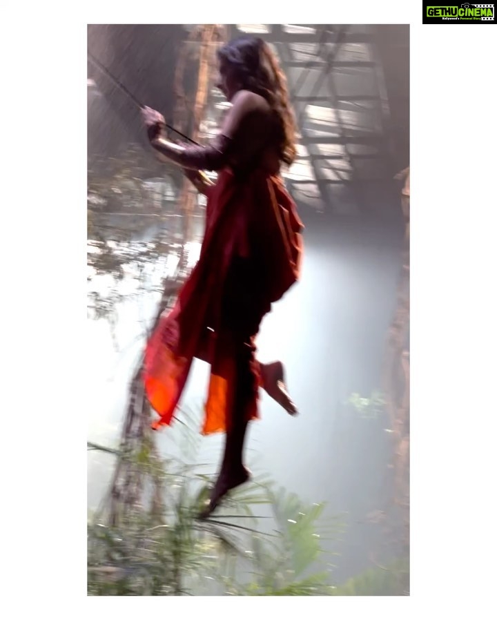 Ashika Ranganath Instagram - BTS of Evergreen #ennoratrulosthayi song! From stressful night schedules to flying in the song (with a harness of course), endless costume trials & rehearsals.. Everything was worth it for the love we are receiving (especially for the song) now! I’d like to thank Kalyan sir for being a marvellous co-star, Shobi master & team for a wonderful choreography, Ashwin & Rajesh for the beautiful costumes, @urjapatel_artistry & @paramesh_hairstylist for making me look great as usual & staying up all night & taking good care of me. @mythriofficial for the amazing production, set & making me part of this superb journey! Loved every bit of it! #Amigosintheatresnow
