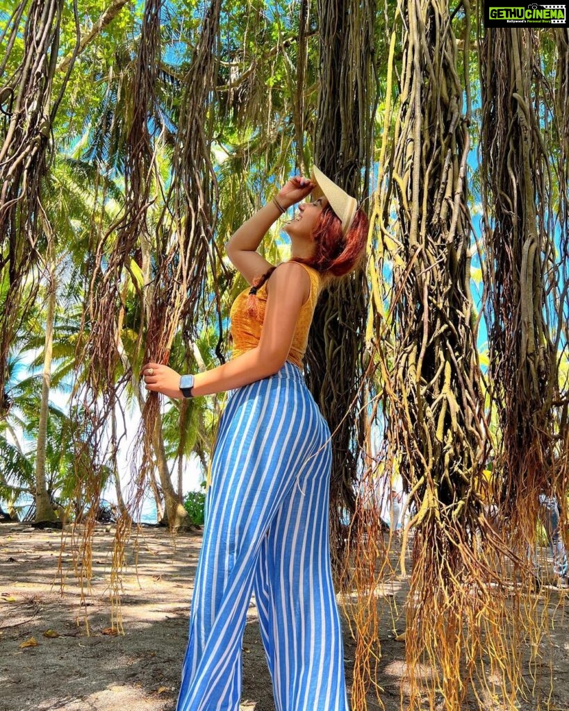 Ashnoor Kaur Instagram - Banyan tress, ocean breeze… Curious mind, a little at ease… Endless summer, take me there… Wanderlust spirit, with forest wood in air🪵 . #ashnoorwrites #maldives #forest #islandlife (Swipe till the end to see me as Tarzan🤣) . . . Wearing @howwhenwearclothing Jewellery @designsbyjewelsgalaxy @designsandyoustudio Hat @merakilifestudio @planmyleisure @sunsiyamresorts @sunsiyamiruveli #planmyleisure #sunsiyam #iruveli Maldives
