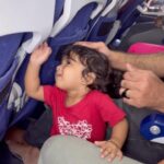Aswathy Sreekanth Instagram - Who doesn’t like some inflight entertainment ?? 🫢😁watch her face while leaving the plane 😁😁 പെണ്ണ് അടി വാങ്ങി തന്നേനെ 😜 #instareels #babyreels #naughtykid #babyonboard #traveltime #toddler #travelingwithkids #indigo