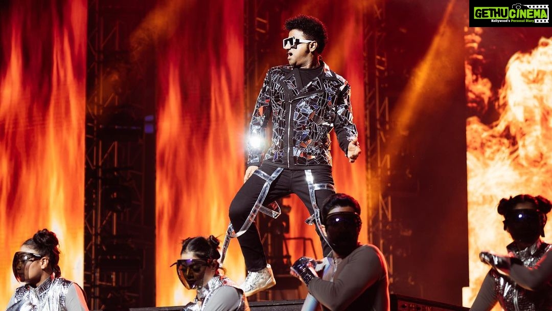 Devi Sri Prasad Instagram - ✨ Witnessing the magnificence of DSP's entry at the concert was an absolute game-changer! 🌟✨ From the moment he stepped on that stage, it was clear that this man knows how to make an entrance like no other. The air was charged with anticipation as the crowd erupted in thunderous applause, and the energy in the room soared to new heights. DSP's presence was electrifying, his charisma captivating, and his passion for music contagious. The atmosphere was nothing short of pure magic as he set the stage on fire with his mesmerizing talent. It was a moment that will forever be etched in our hearts. 🎶❤️ #DSPConcert #EntranceMaster #musicalmagic #oosolriyaoooosolriya Bukit Jalil National Stadium