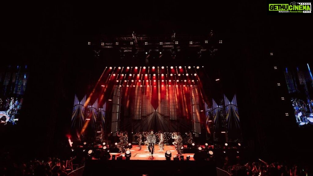 Devi Sri Prasad Instagram - ✨ Witnessing the magnificence of DSP's entry at the concert was an absolute game-changer! 🌟✨ From the moment he stepped on that stage, it was clear that this man knows how to make an entrance like no other. The air was charged with anticipation as the crowd erupted in thunderous applause, and the energy in the room soared to new heights. DSP's presence was electrifying, his charisma captivating, and his passion for music contagious. The atmosphere was nothing short of pure magic as he set the stage on fire with his mesmerizing talent. It was a moment that will forever be etched in our hearts. 🎶❤ #DSPConcert #EntranceMaster #musicalmagic #oosolriyaoooosolriya Bukit Jalil National Stadium