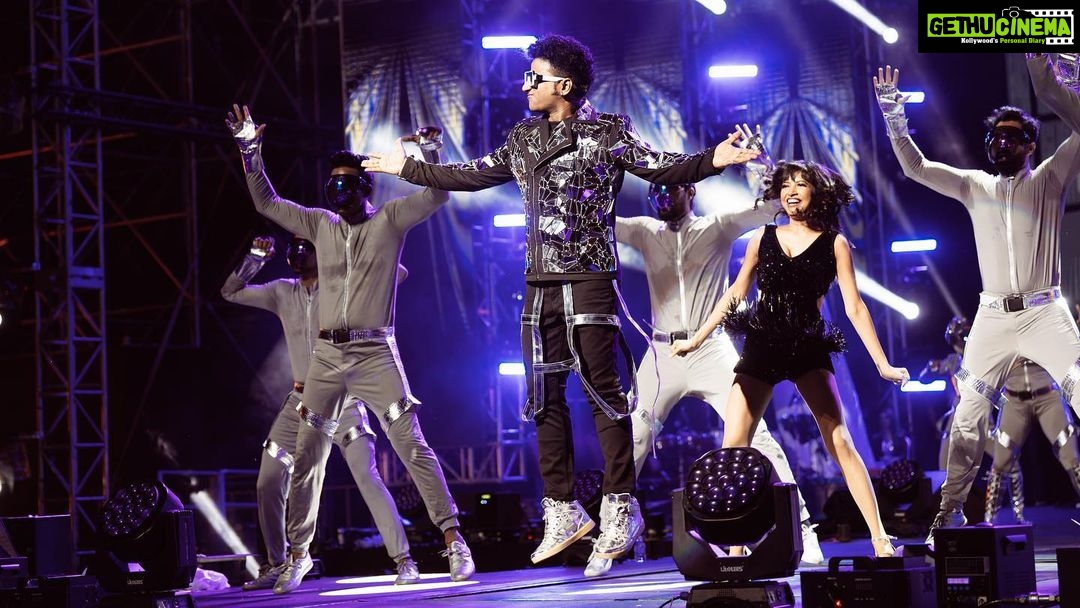 Devi Sri Prasad Instagram - ✨ Witnessing the magnificence of DSP's entry at the concert was an absolute game-changer! 🌟✨ From the moment he stepped on that stage, it was clear that this man knows how to make an entrance like no other. The air was charged with anticipation as the crowd erupted in thunderous applause, and the energy in the room soared to new heights. DSP's presence was electrifying, his charisma captivating, and his passion for music contagious. The atmosphere was nothing short of pure magic as he set the stage on fire with his mesmerizing talent. It was a moment that will forever be etched in our hearts. 🎶❤️ #DSPConcert #EntranceMaster #musicalmagic #oosolriyaoooosolriya Bukit Jalil National Stadium
