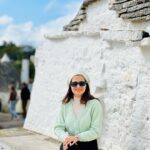 Dhivyadharshini Instagram - The beauty of alberobello town (Italy) is mesmerising This town is easily more than 500 hundred years old and the trulli (the type of house you see remains untouched and well preserved with stone structures that have no cement between them) it’s a unesco world heritage site @gtholidays.in and I wanted to show you the less explored locales of every country in our holidays 😉 Go to my stories to see more of it ❤️ #ddholidays #gtholidays #ddneelakandan #travel #italy #alberobello #trulli #holiday #tourism @italyexplores Trulli di Alberobello