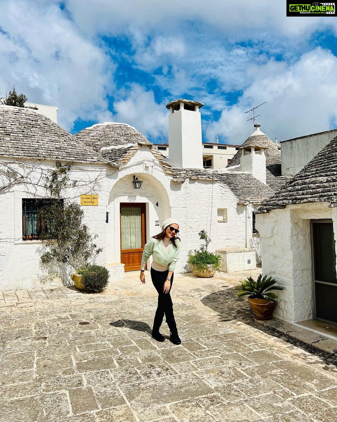 Dhivyadharshini Instagram - The beauty of alberobello town (Italy) is mesmerising This town is easily more than 500 hundred years old and the trulli (the type of house you see remains untouched and well preserved with stone structures that have no cement between them) it’s a unesco world heritage site @gtholidays.in and I wanted to show you the less explored locales of every country in our holidays 😉 Go to my stories to see more of it ❤️ #ddholidays #gtholidays #ddneelakandan #travel #italy #alberobello #trulli #holiday #tourism @italyexplores Trulli di Alberobello