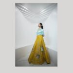 Ivana Instagram - An exquisite fit for the fashion-forward bride! @savinidii_official 💙💛 Kickstart the wedding festivities and charm your guests with our scintillating pastel satin shirt and silk lehenga set! This captivating combo carries hand-embroidered floral detailing and works as the ideal choice for your pre-wedding Mehndi party! Outfit & Styling @savinidii_official @eega_praveen Inframe @i__ivana_ Shot by @crackjackphotography @jenovin Makeup @b3bridalstudio Jewellery @mspinkpantherjewel Hairdo @hair_by_aiswaryaraj Location @savinidii_official For enquiries, kindly contact us: 9585455055, 9786455055; or email us at savinidii2020@gmail.com • . . . #satinshirt #handembroidery #savinidiibride #satin #pastelshirt #bridalwear #lehenga #savinidii #bride #fashion #wedding #bridallehengas #bridal #southindianweddings #bridetobe #onlineshopping #bridallehenga #ethnicwear #designer #weddinginspiration #designerwear #bridalfashion #bridaldress #lehengacholi #fashiondesigner #intricatedesign #lehengas #chennaidesigner #southindianbride