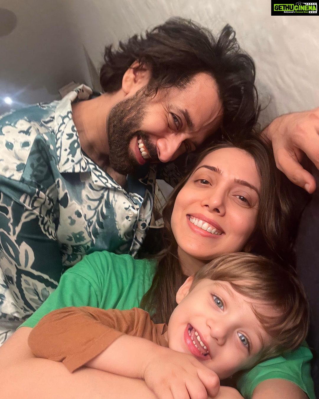 Jankee Parekh Instagram - As Sufi is growing up,we’ve begun to realise that he needs constant engagement, connection,activities & people to play with just like any other toddler .. & not to forgot — always wanting to be with his ‘Mumma’. Some days have been delightful,while others have been utterly exhausting.We've experienced 3 to 4 meltdowns in a single day & I find myself in a constant negotiation with him,striving to be logical,patient & compassionate in helping him understand why he can't lift those dumbbells, devour an entire tube of toothpaste, undo an entire toilet roll into the pot,play the keyboard with his feet,or grab the masala box from the kitchen to taste the red hot mirchi powder. But through all of this,I remind myself that logic often fails to work with our little ones,whose beautiful and tiny brains are growing at an astonishing rate,leaving them overwhelmed by emotions when things don't go their way. & just when it seems like nothing works for him, all he longs for is his Mumma's comforting embrace where he can vent his feelings. Throughout the day,there are numerous instances when he eagerly runs towards me, planting a tender kiss or wrapping his little arms around me. So whilst he doesn’t understand logic he understands what deep connection & love is, especially when we spend afternoons on the bed,with him lying on my stomach & both of us just staring at the birds and the beautiful flowers outside the window. It’s at this point when all the exhaustion slowly begins to fade away,as I feel so deeply grateful, connected, blessed and at peace to be experiencing this kind of unadulterated love in my lifetime.I also become completely aware of the fact that I am one of the two people he is fully dependent on and can trust his life with,the other person being his Dadda. Sufi's favourite part of the day is when Dadda returns home from work & he eagerly waits to help put his shoes on the rack & his socks in the laundry basket.As Nakuul walks through the door,I feel a sense of relief,knowing that it's now Dadda's turn to take over. This photograph captures one of those blissful evenings when Dadda arrived home, & Sufi excitedly exclaimed, "Mumma - Dadda ..Photu ?”❤️