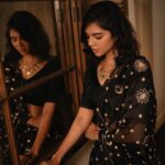 Kalyani Priyadarshan Instagram – Currently obsessed with the vibe of summer blacks 🖤

📸: @merin__georg